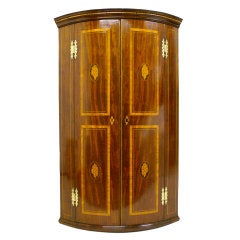 A very attractive George IV Mahogany bow-fronted corner cupboard