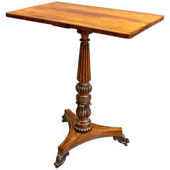 A rosewood and brass inlaid tripod table in the manner of Gillow's