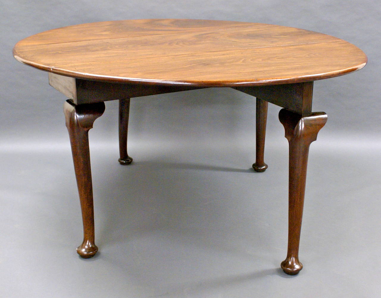 On cabroile legs with pad feet, the oval top is of outstanding colour and patina. The table is in very good and original condition, circa 1750.