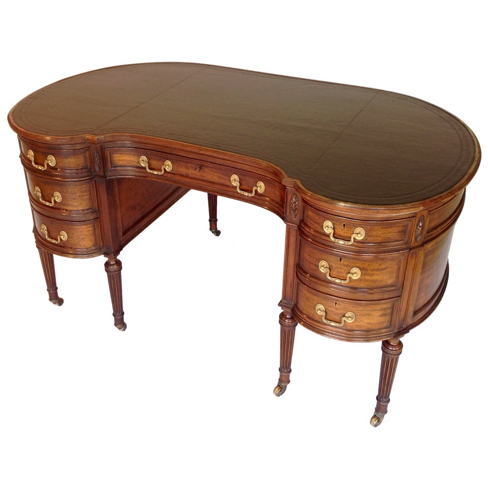 A fine kidney shaped mahogany writing table