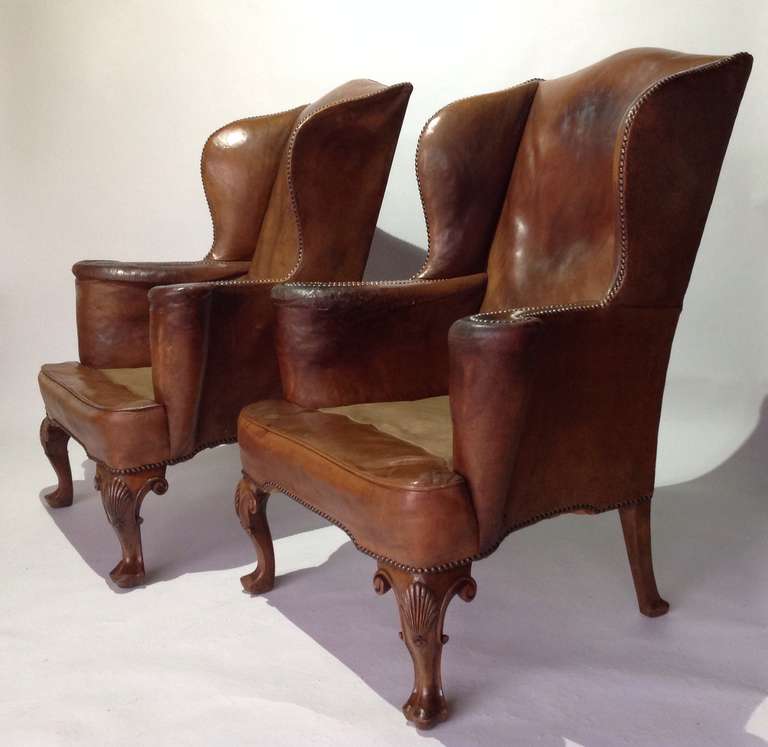 These chairs are in a lovely patinated and well worn state. The leather is still however in good condition without any rips or damage they are a good generous scale and are extremely comfortable!
The seat cushions were originally in a velvet fabric