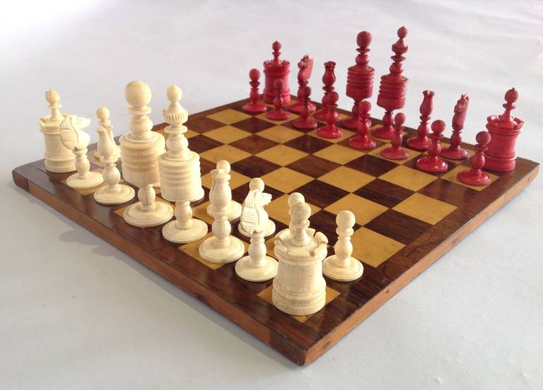 This board is a nice example of the late Victorian chess board with Rosewood and Boxwood squares. The chess pieces are made of bone and are nicely carved and complete.
A good useable set and a good size you can play anywhere!