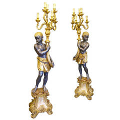 A pair of highly decorative Venetian Blackamoor Torcheres