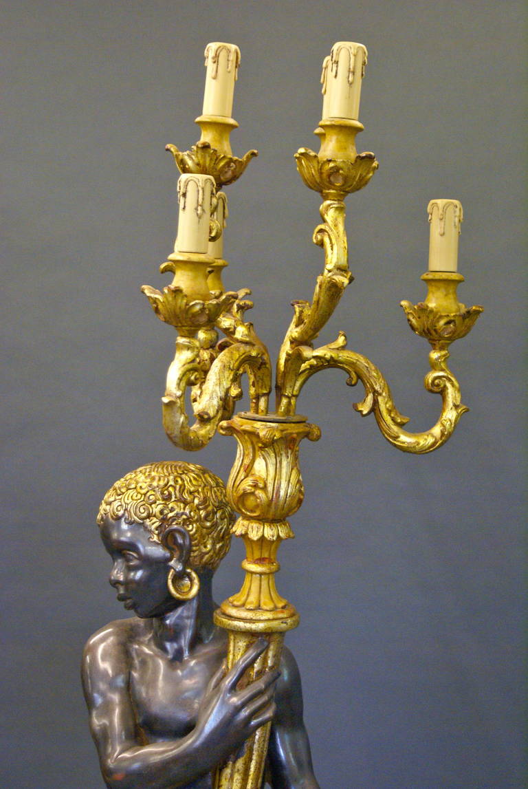 A pair of highly decorative Venetian Blackamoor Torcheres 1