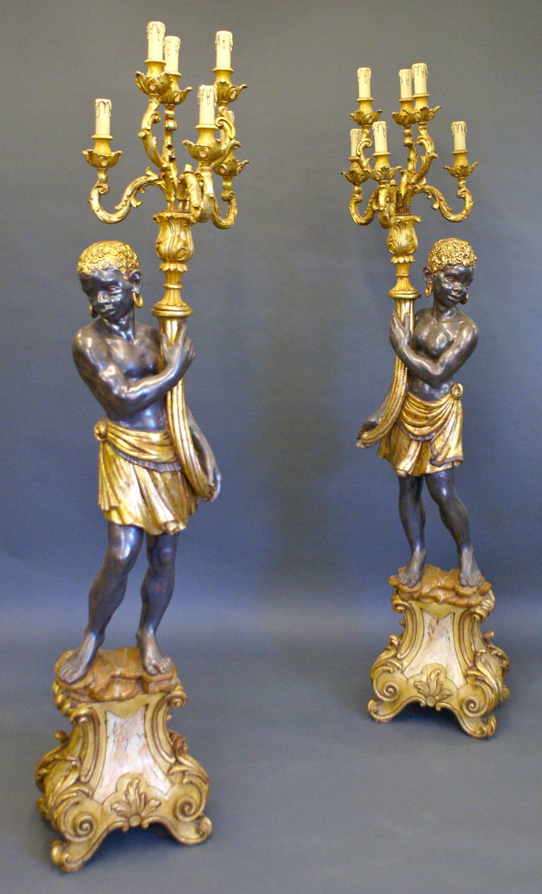 Made from Italian hand carved wood in faux marble, water gilt gold and are intricately carved and detailed.