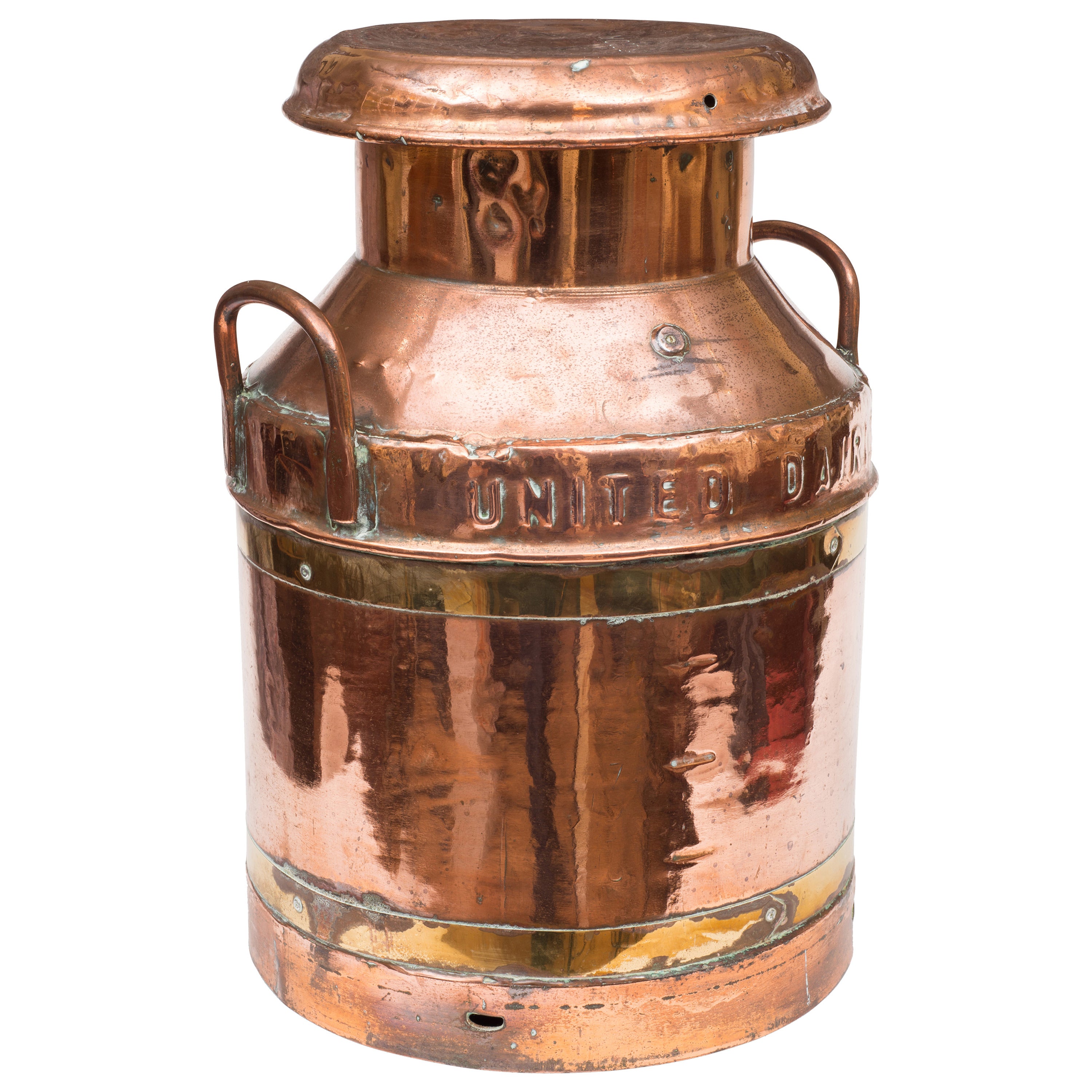 A brass and copper milk churn