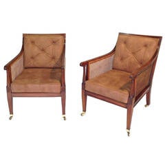 Pair of mid 19th century mahogany bergeres or library chairs Circa 1860