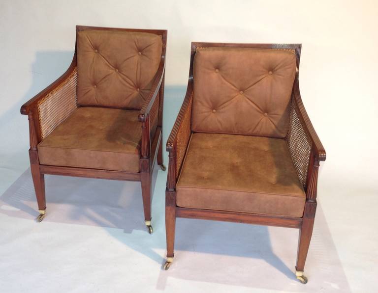 Regency Pair of mid 19th century mahogany bergeres or library chairs Circa 1860