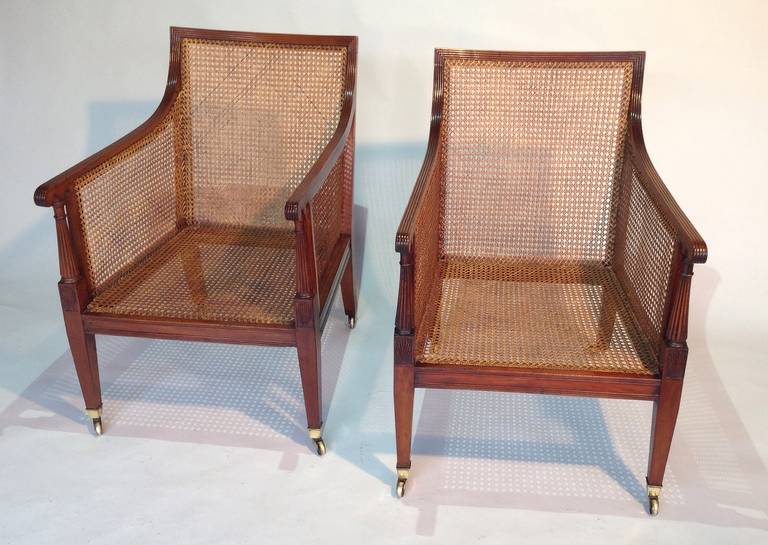 Cane Pair of mid 19th century mahogany bergeres or library chairs Circa 1860