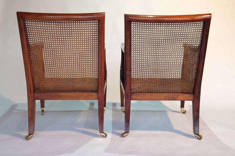 Pair of mid 19th century mahogany bergeres or library chairs Circa 1860 1