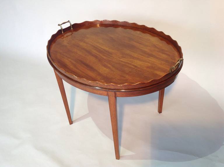 A George III mahogany oval tray on stand. Circa 1800.