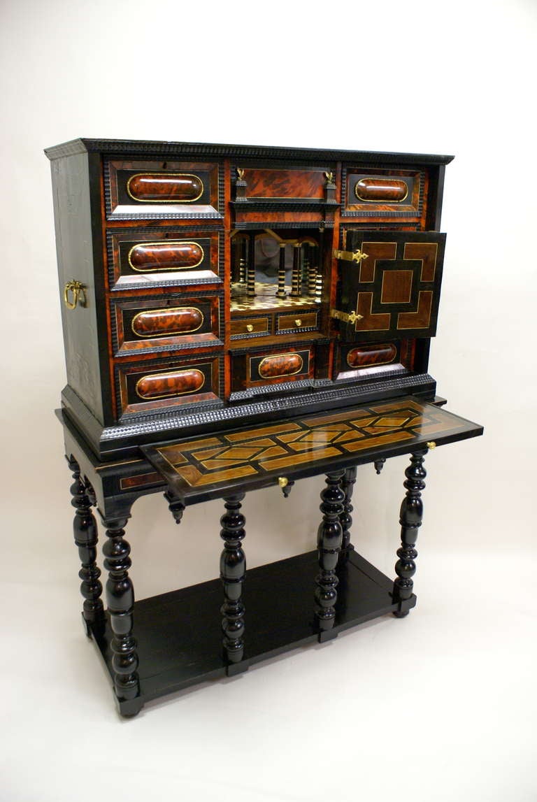 Baroque A late 17th Century Flemish Tortoise shell and ebony cabinet on stand.