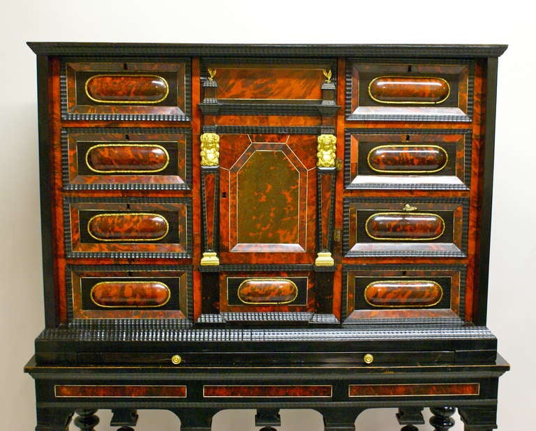 18th Century and Earlier A late 17th Century Flemish Tortoise shell and ebony cabinet on stand.