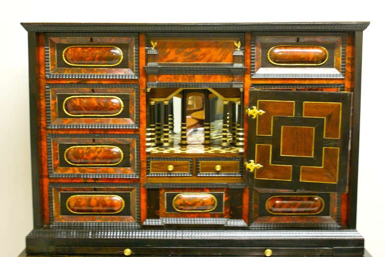 A late 17th Century Flemish Tortoise shell and ebony cabinet on stand. 2