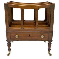 A Regency mahogany boat shaped Canterbury.