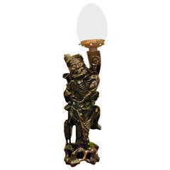 A 19th century Japanese carved wooden figure/lamp