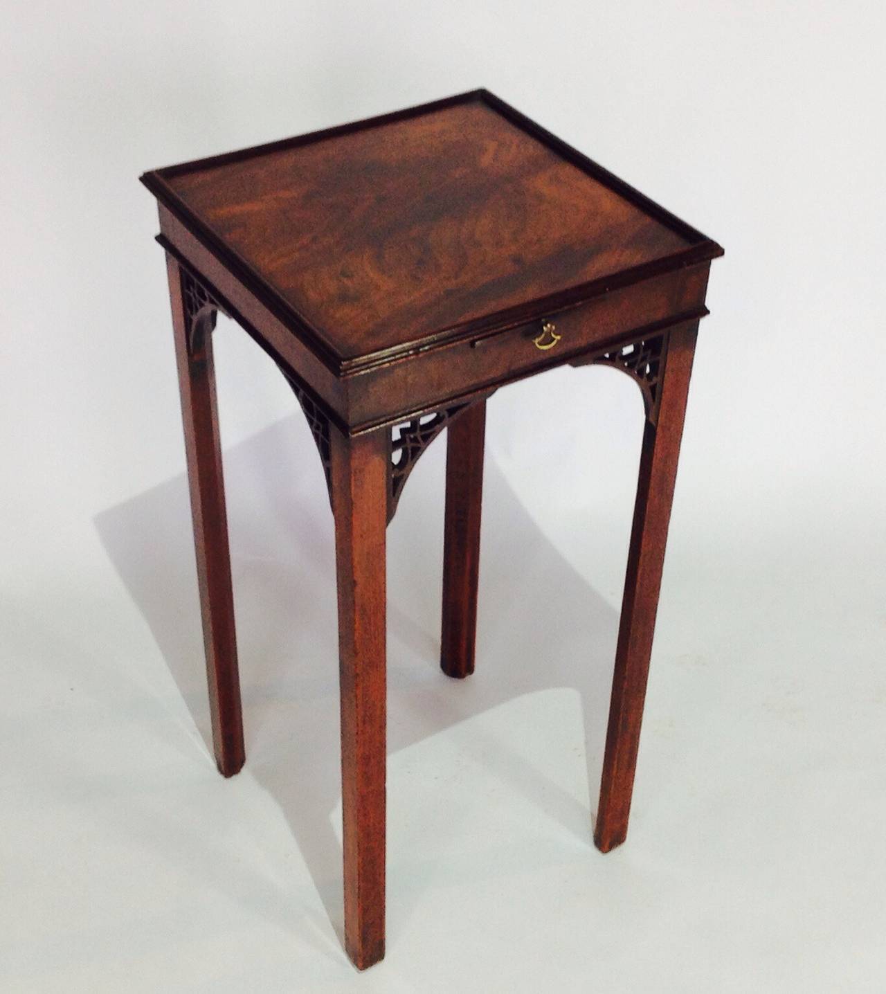 This little George III table is in a lovely un-touched condition and a fantastic colour with well figured timber. It retains all the original Chinese Chippendale style corner brackets and the pull out slide.
These little kettle stands make an ideal