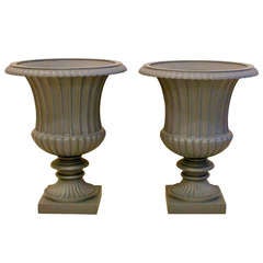 A fine pair of mid 19th century cast iron garden urns.