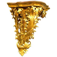 A superb 19th century Venetian carved gilt-wood corner wall bracket