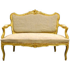 A highly decorative Venetian carved gilt wood sofa.