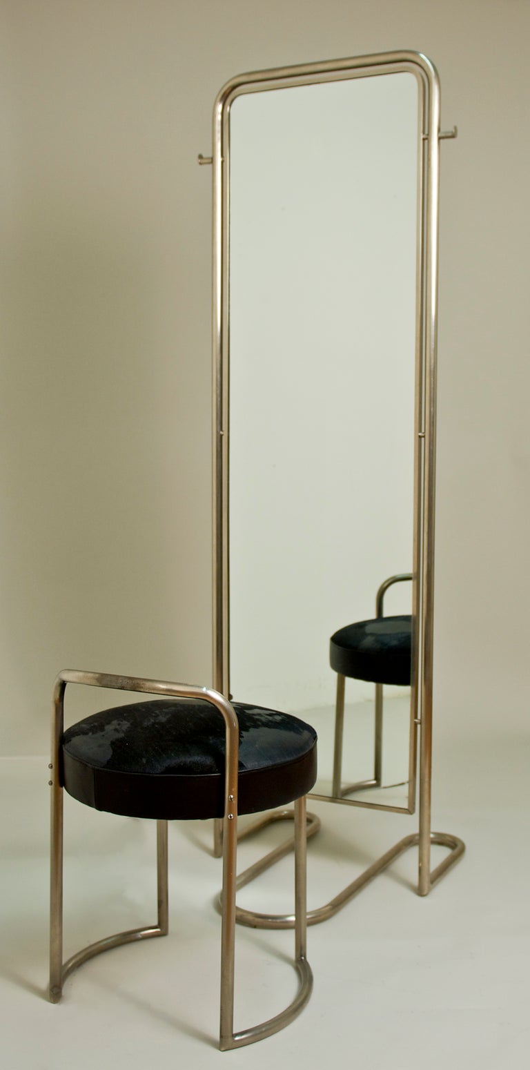 Louis Sognot chrome- plated steel and mirrored glass full length with original leather and chrome- plated steel ottoman.