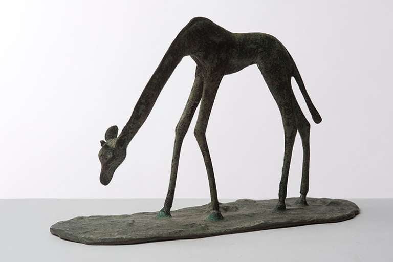 Small continental bronze of giraffe.