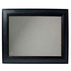 Late 19th c. ebonised fame with antique mirror.