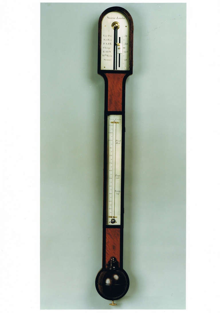 A good late 18th century satinwood crossbanded stick barometer by this famous barometer maker.

Both the silvered and engraved register plates and inset therometer are signed and each has a separate flush fitting door. The arched top case is