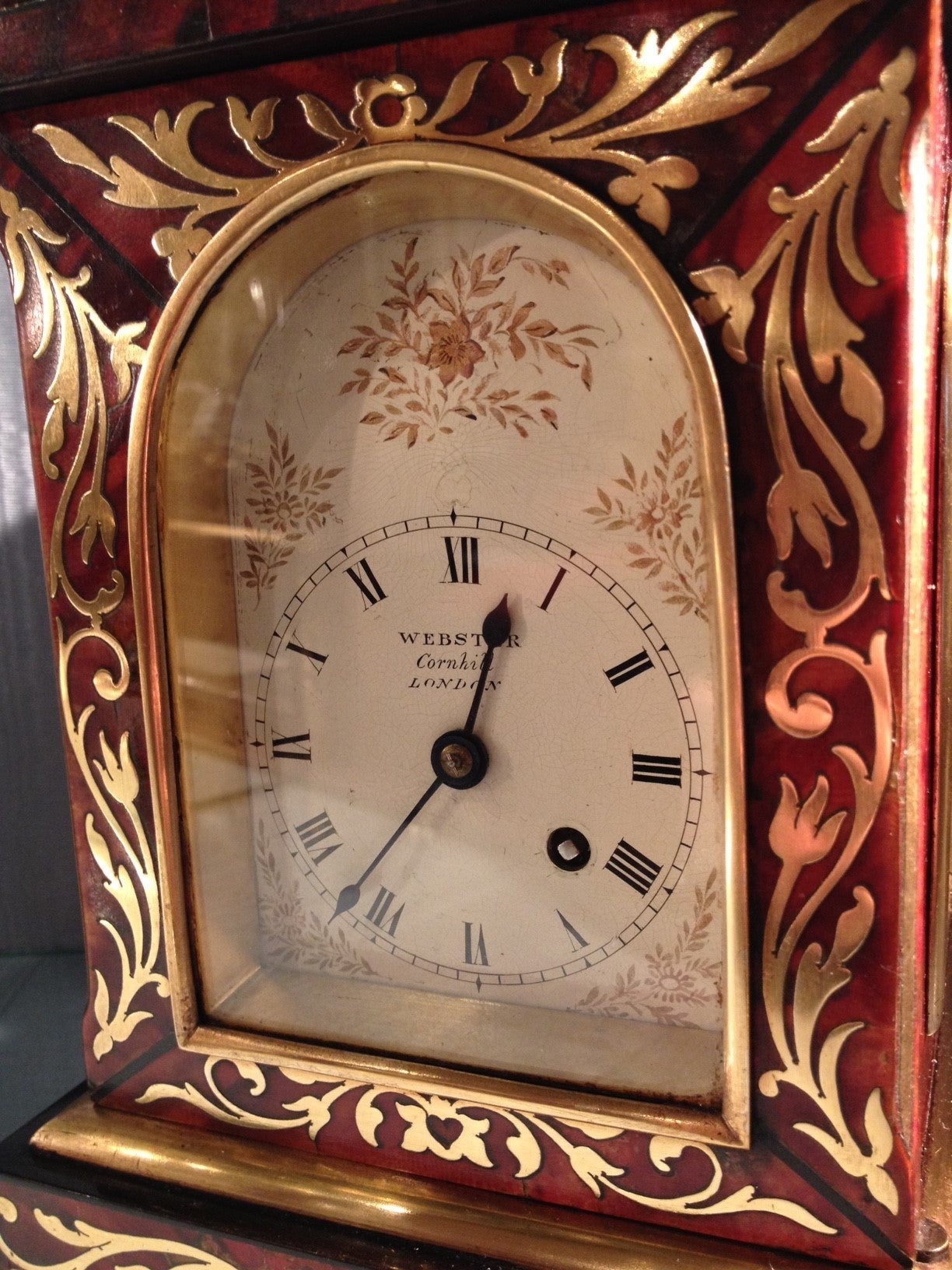 A charming Regency period red tortoiseshell and brass inlaid mantel timepiece, by this celebrated family of London clockmakers. 

The classically styled glazed case is veneered with red tortoiseshell and inlaid with flowing stem and flower