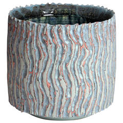 Grey, Black and Red Cylindrical Vessel