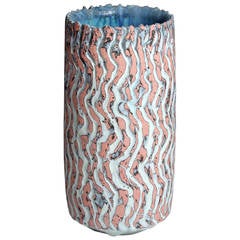 Pink and Black Cylindrical Vessel
