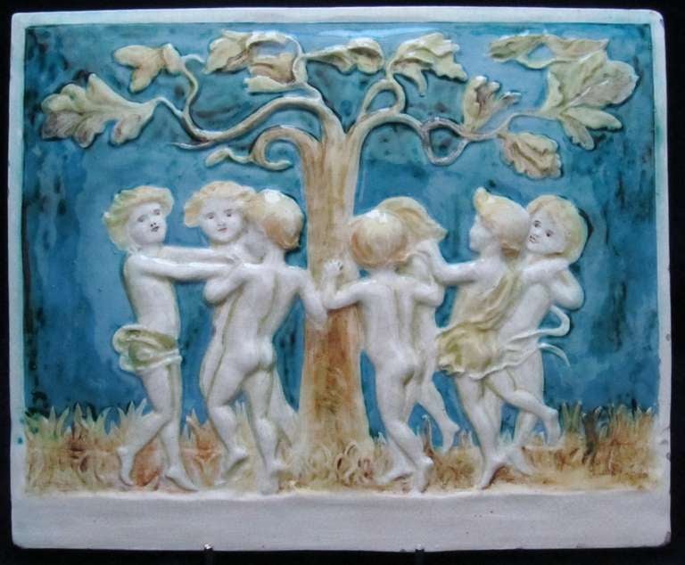 Della Robbia Plaque decorated in relief with a group of Dancing Children by Miss M Furniss.