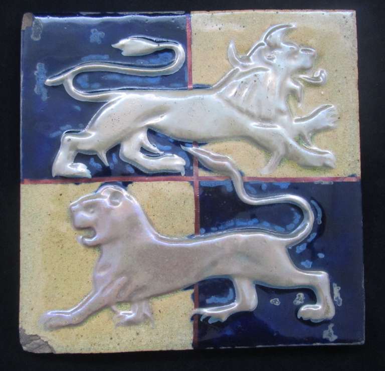 William De Morgan Tile decorated in relief with lions in a lustre glaze, the design attributed to Halsey Ricardo. Chips to two corners