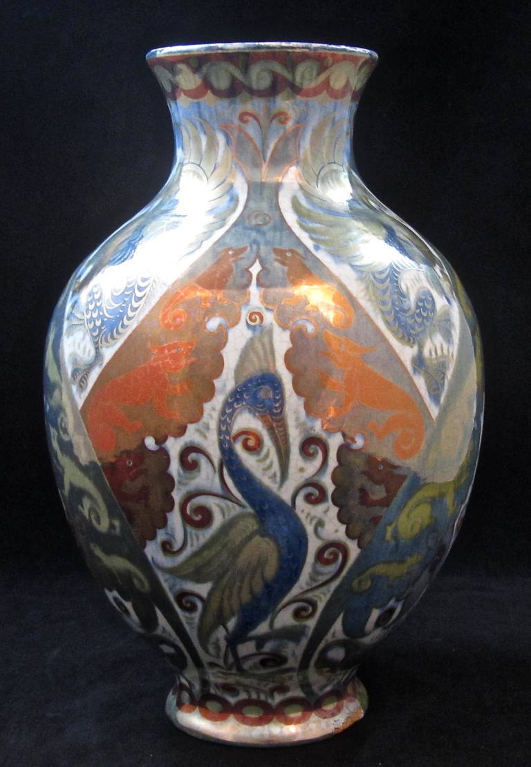 Scarce William De Morgan triple lustre vase decorated with beasts, birds and dogs. Unmarked. Chip to foot rim.