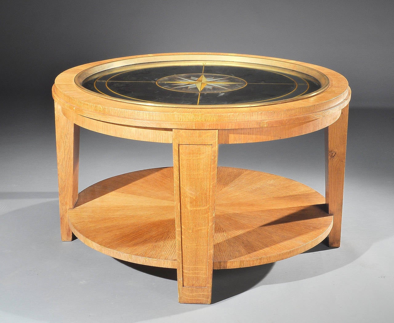 Important pedestal table attributed to Jacques Adnet in pale oak holding an 