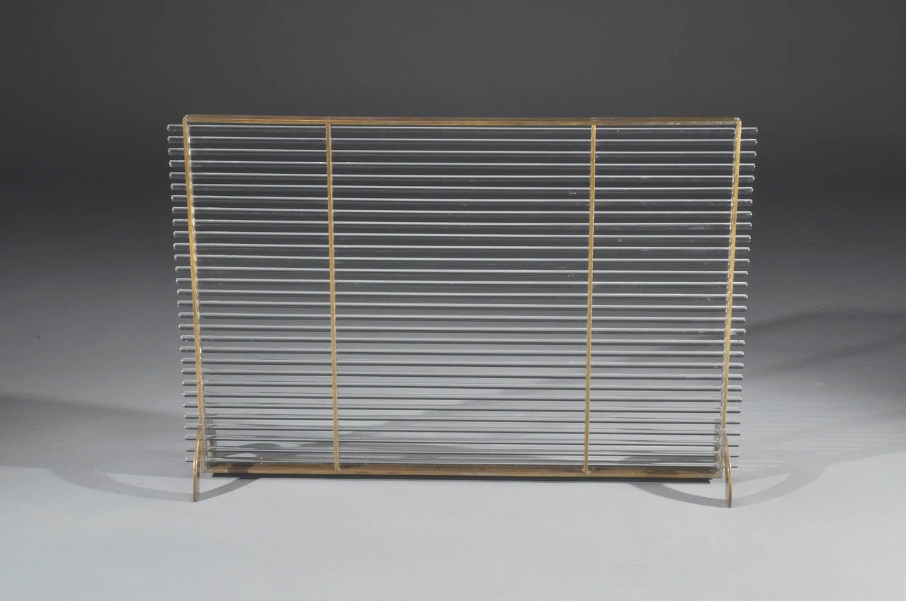 Brass and glass modernist fire screen attributed to Boris Lacroix, circa 1930.