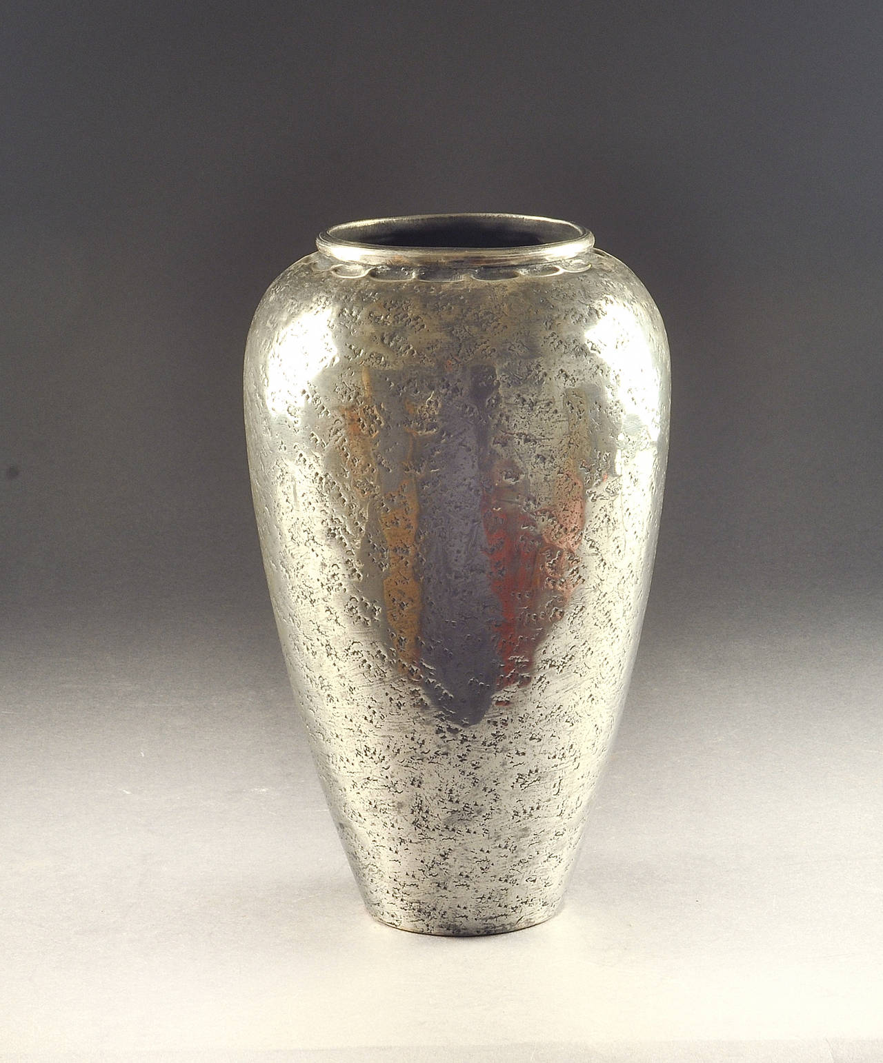 Jean Dunand early 1910s metal vase. Signed and numbered.