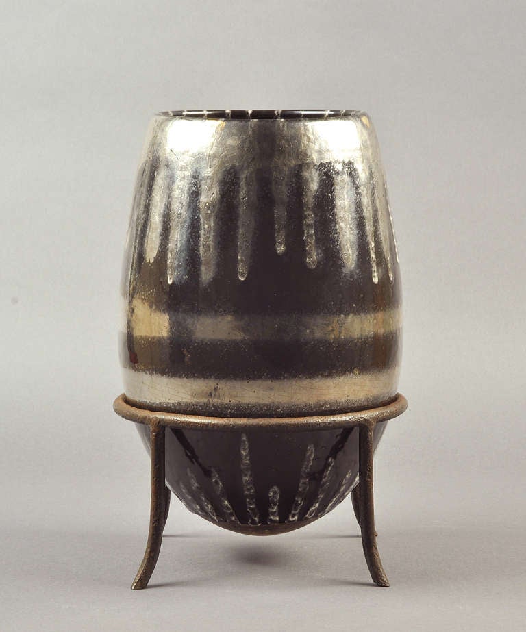 Rare Jean Besnard large Art déco silvered glazed ceramic vase. Circa 1930. Wrought iron stand. Artist's monogram signature 