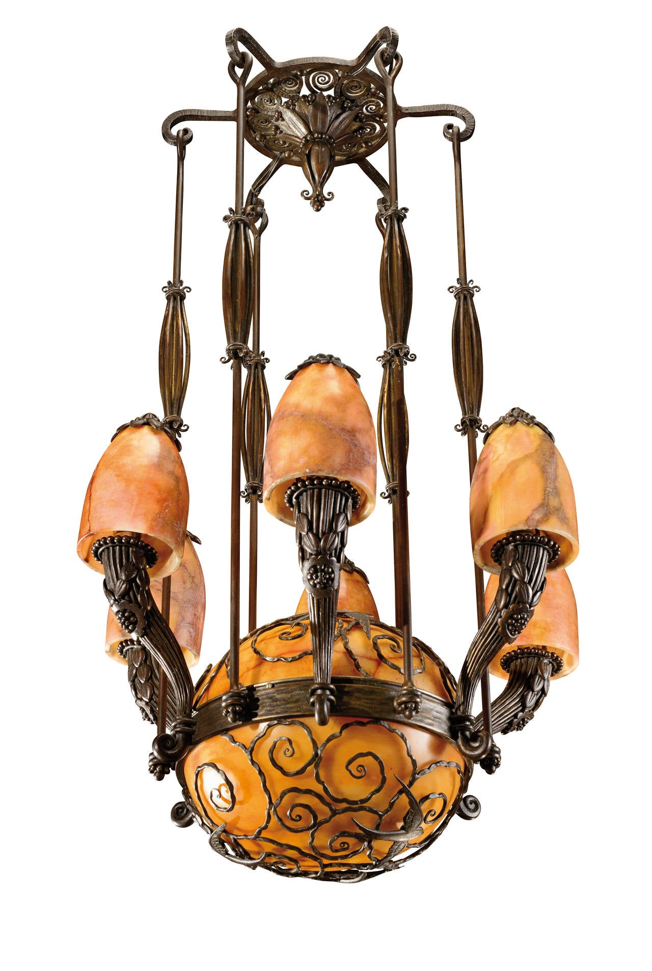 Large hammered wrought iron centre light holding a sphere and alabaster shade with six branches of lights representing horns of plenty surmounted by orange tulips.
Circa 1925.