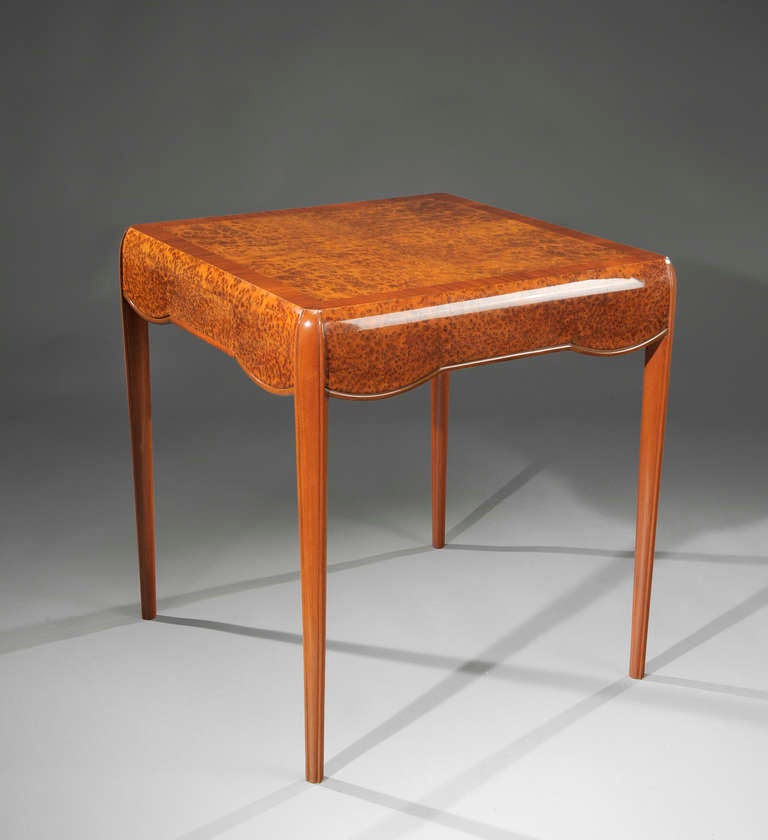 Game table by Lucie Renaudot in burr tuya veneer and mahogany. Two drawers set in the apron. Circa 1925.

