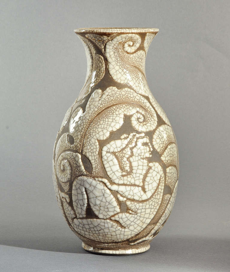 Rare René Buthaud vase in crackled ceramic with a neoclassical embossed decor. Circa 1930.
Artist monogram signature 