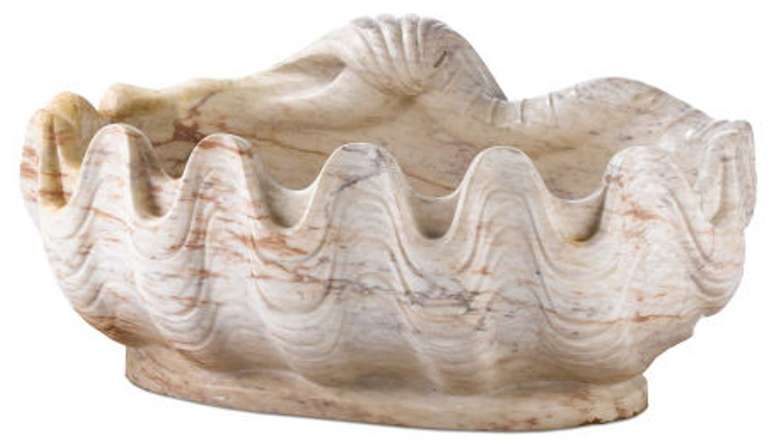 Massive variegated marble grotto basin in the form of a half-shell, scalloped rim and wavy side designs, drain hole in bottom.