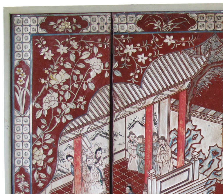 19th c. Coromandel table secreen.  White, cream and grey on cinnabar red ground, with aqua blue figures.  Now mounted in frame.