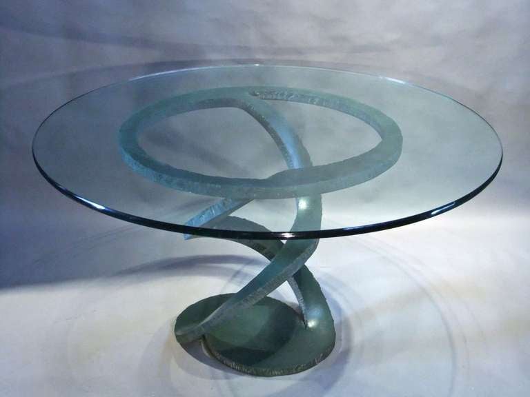 Wrought metal painted centre table with clear glass top possibly by Vallenti.
