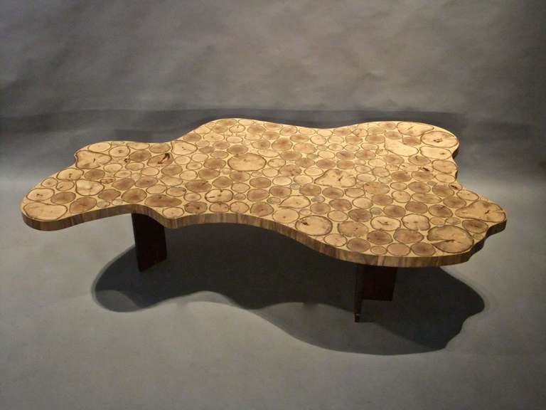 A unique contemporary laminated wood and steel coffee table by Belgium born maker Yves Lefebvre
