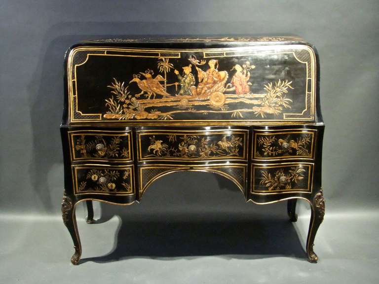 1950's black lacquered bureau with five drawers in the Louis XV taste.

