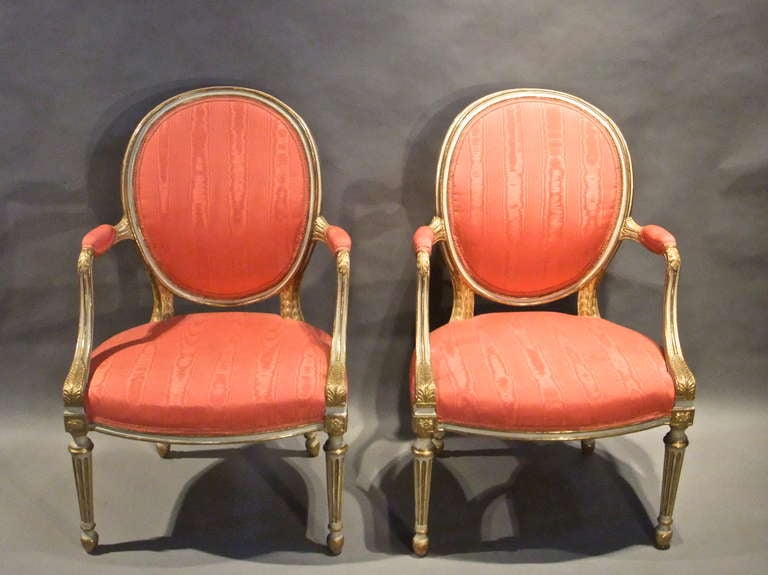 Pair of late 18th century neo-classical armchairs with later painted and gilt decoration in the manner of Robert Adam.
