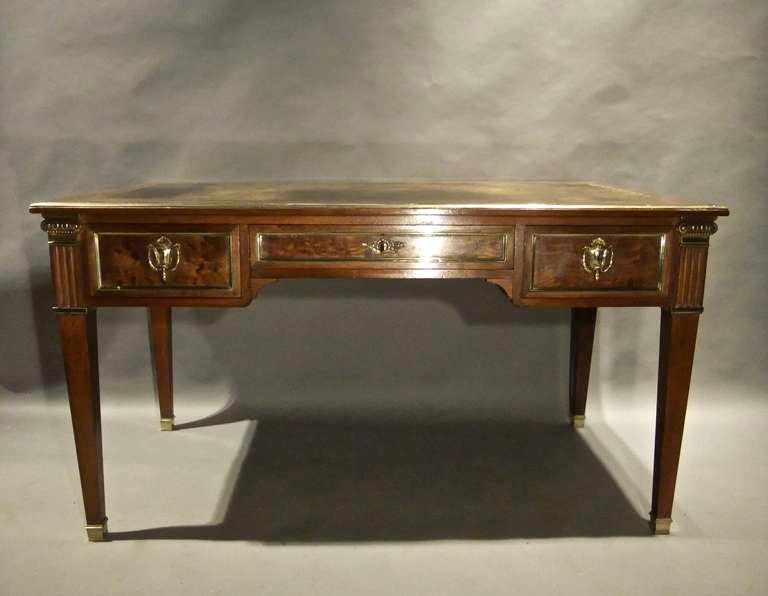 Early 20th century Louis XVI revival plum pudding mahogany desk with original gilt bronze mounts.
