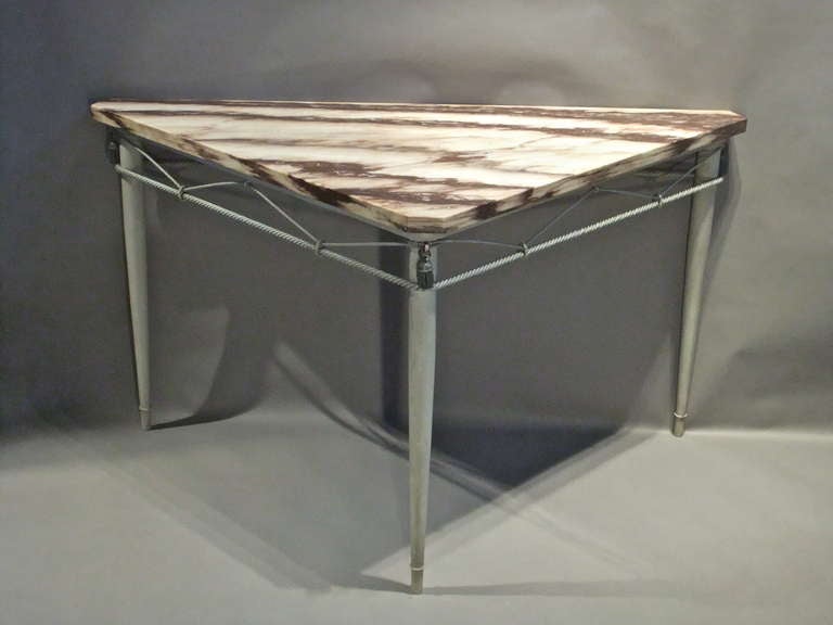 Stylish triangular painted metal centre table with original marble top and metal tassels possibly by Jansen of Paris.
