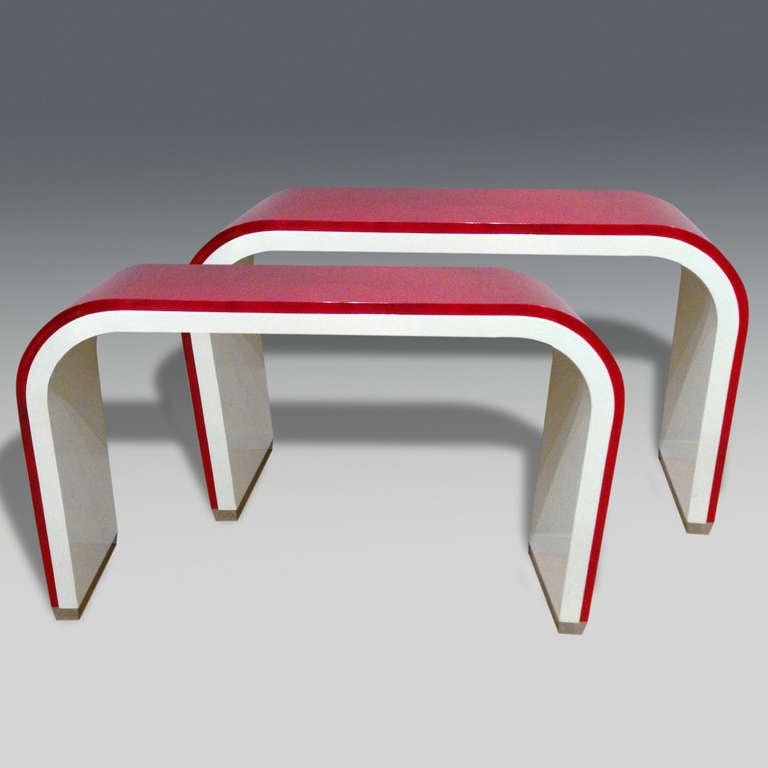 Pair of 1970's Italian red and white lacquered console table with inset stainless steel supports.